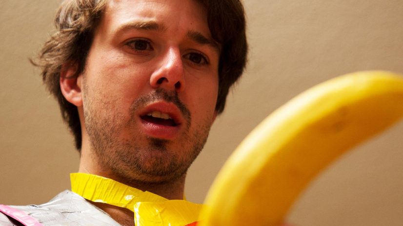 Man Looking at Banana