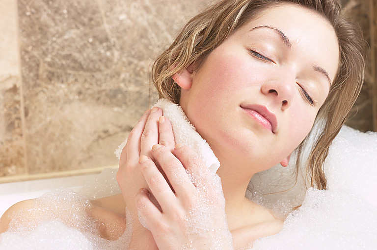 Woman Having a Bath to reduce vaginal odour