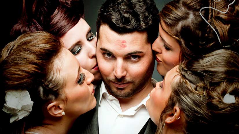 Man Being Kissed by Four Women