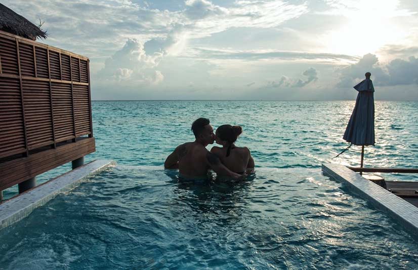 Couple Kissing In a Pool