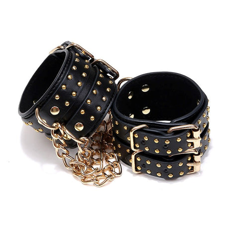 Studded Wrist Cuffs With Chain - Rabbit Vibrators