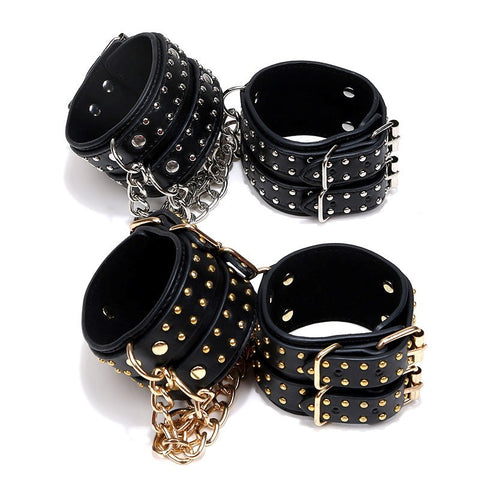 Studded Wrist Cuffs With Chain - Rabbit Vibrators